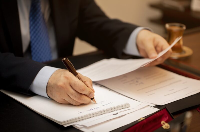 Businessman signing important contract papers Businessman signing important contract papers. High quality photo